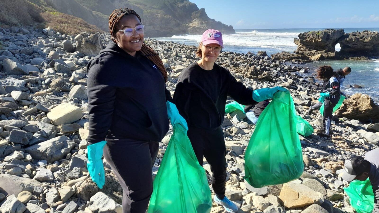 Volunteers collecting trash on the beach