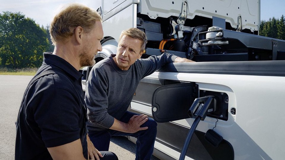 Truck connected to charging station