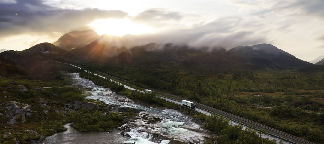 Truck driving through natural landscape